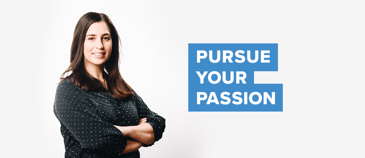 UConn business student, standing with arms crossed. Text overlay: Pursue Your Passion
